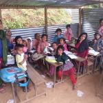 Pupils in tin hut classrooms