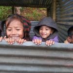 Children of the village in their tin hut classrooms, waiting for the school to reopen